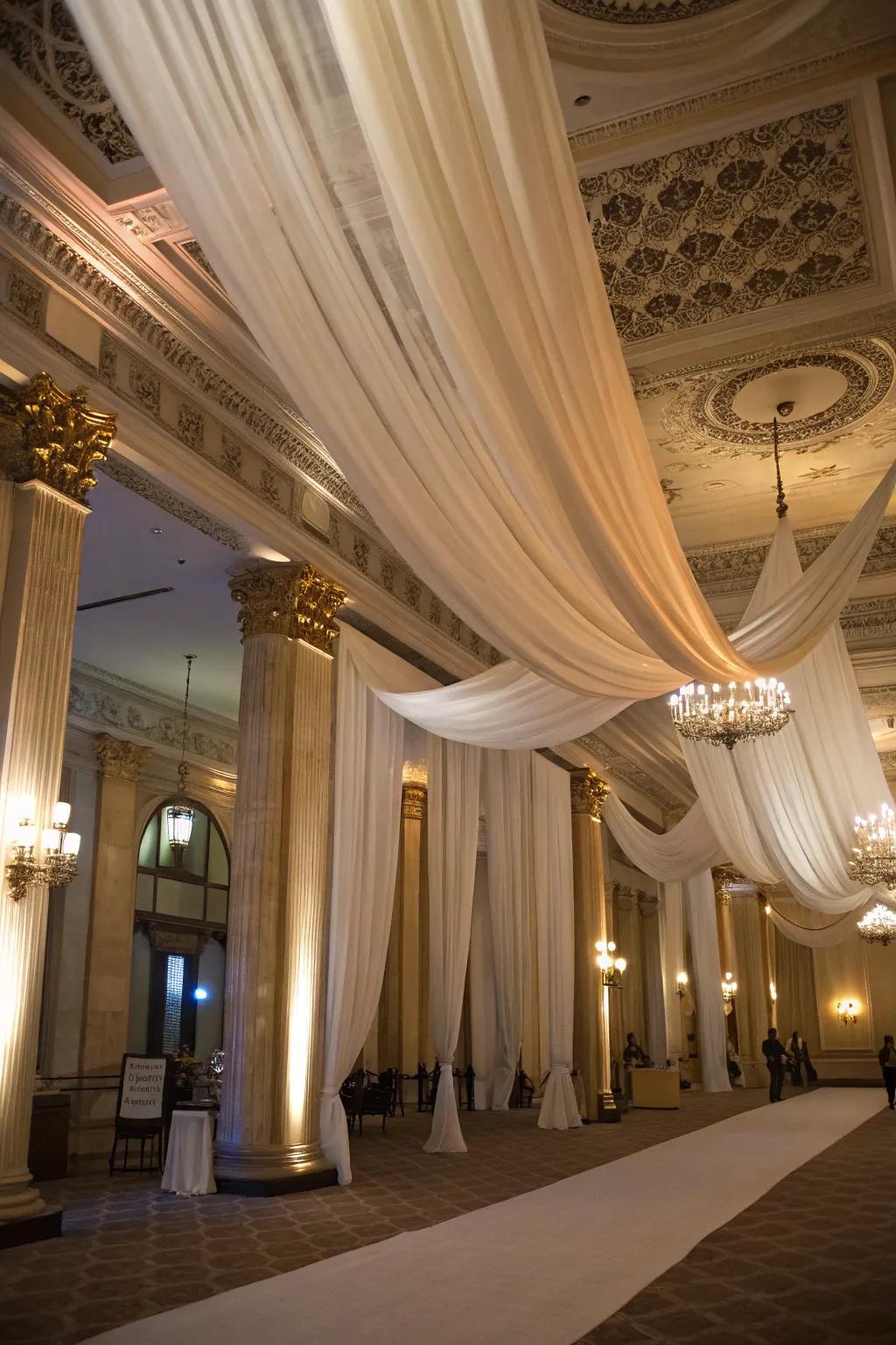 Elegant ceiling drapes bring a luxurious element to the birthday hall.