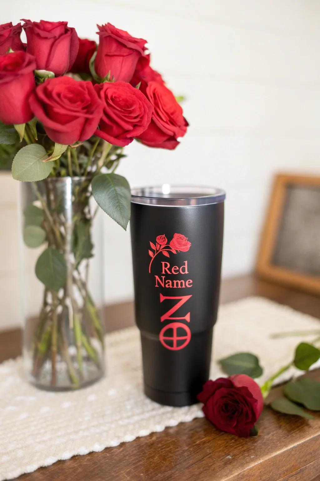 A personalized black tumbler showcasing a striking red name.