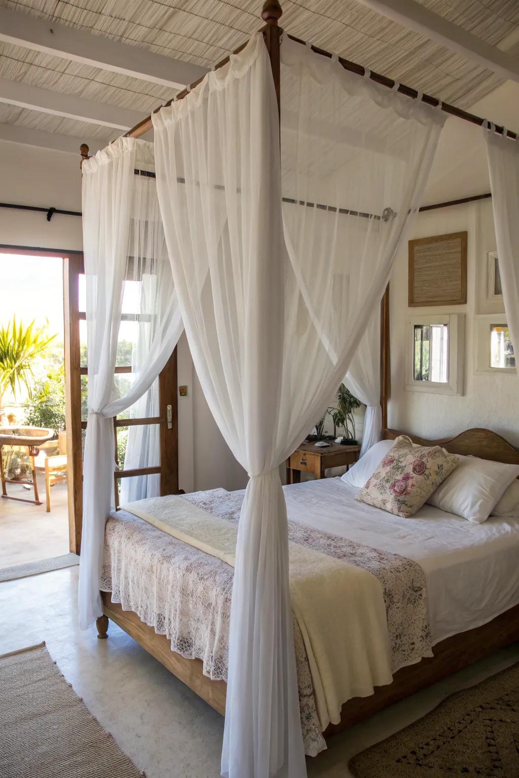 Sheer linens on a canopy bed maintain a luminous and airy atmosphere.