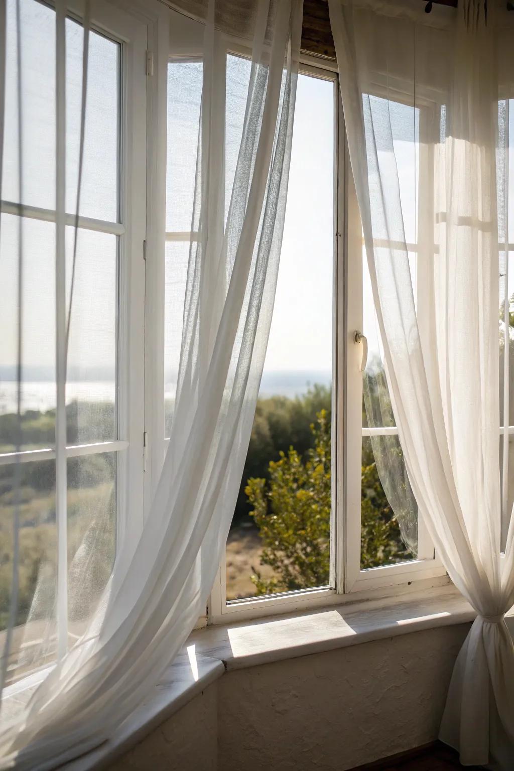 Sheer window coverings add softness to corner windows.