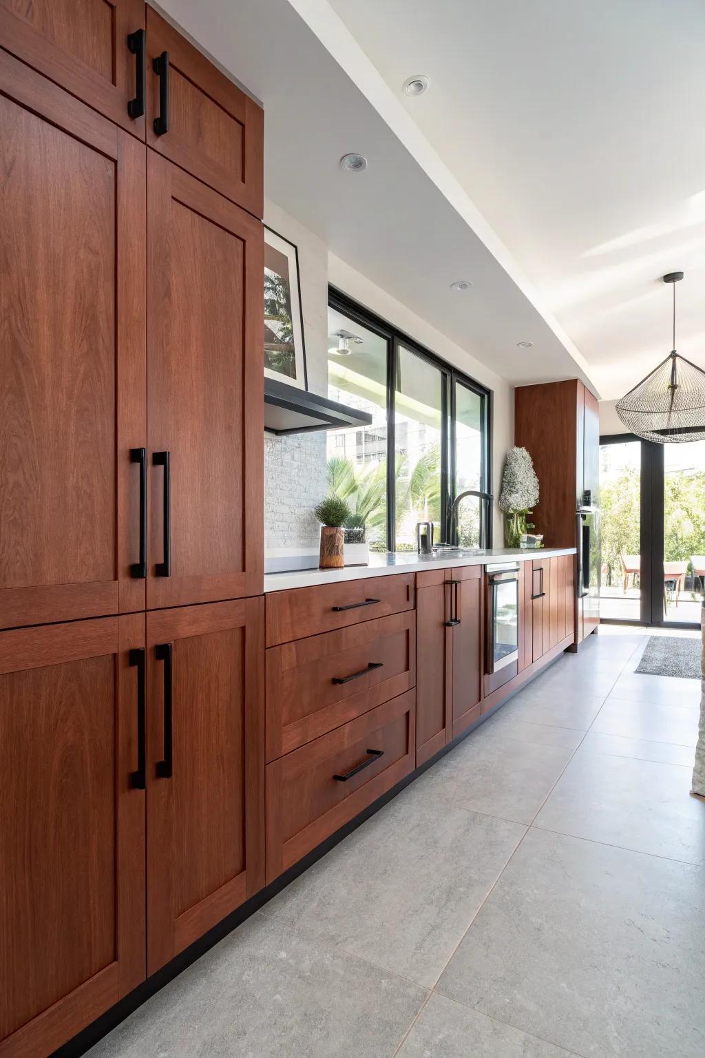 Bold black handles introduce a modern vibe to cherry cabinets.