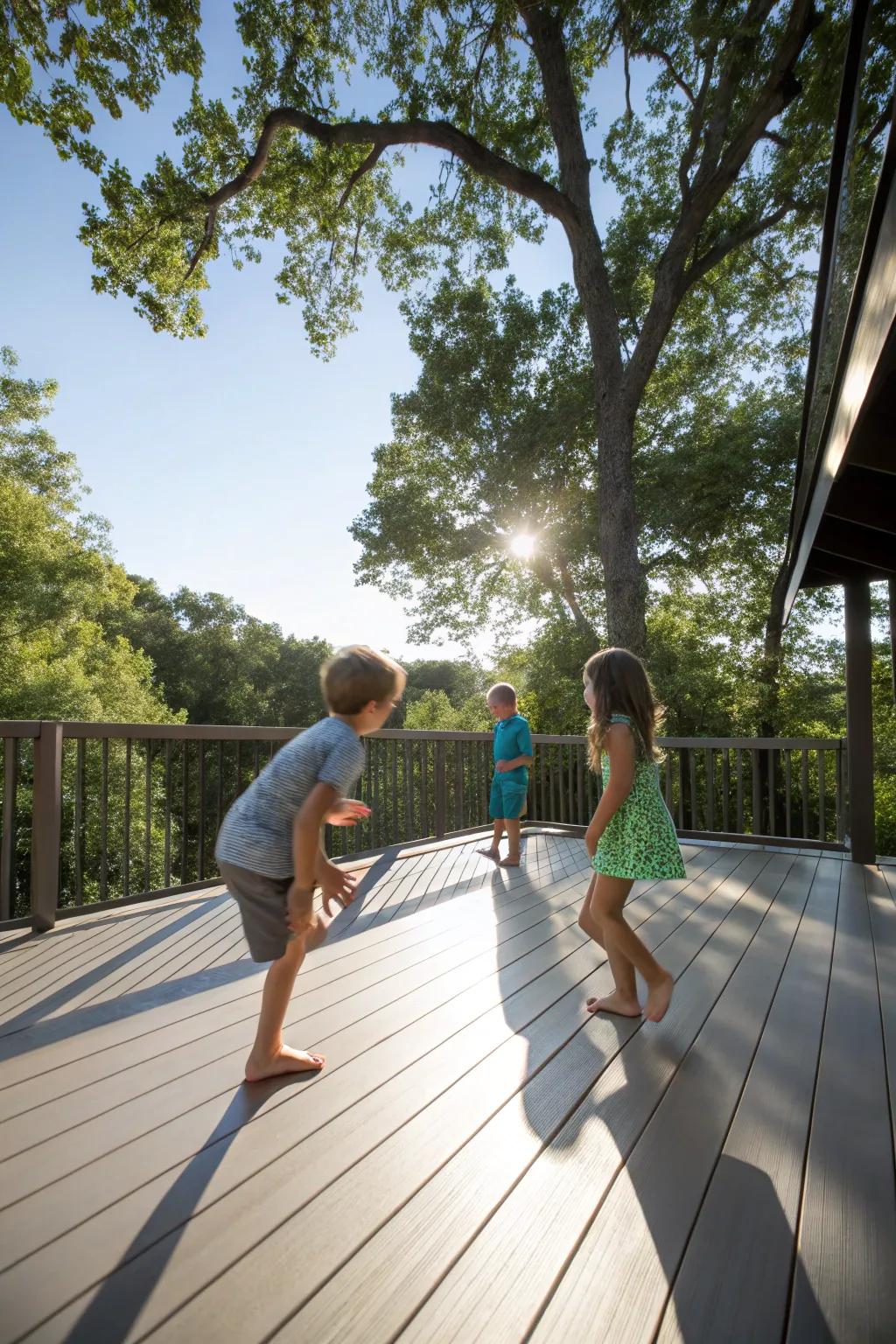 Kids playing barefoot on a smooth synthetic deck, with sunlight streaming through the trees.