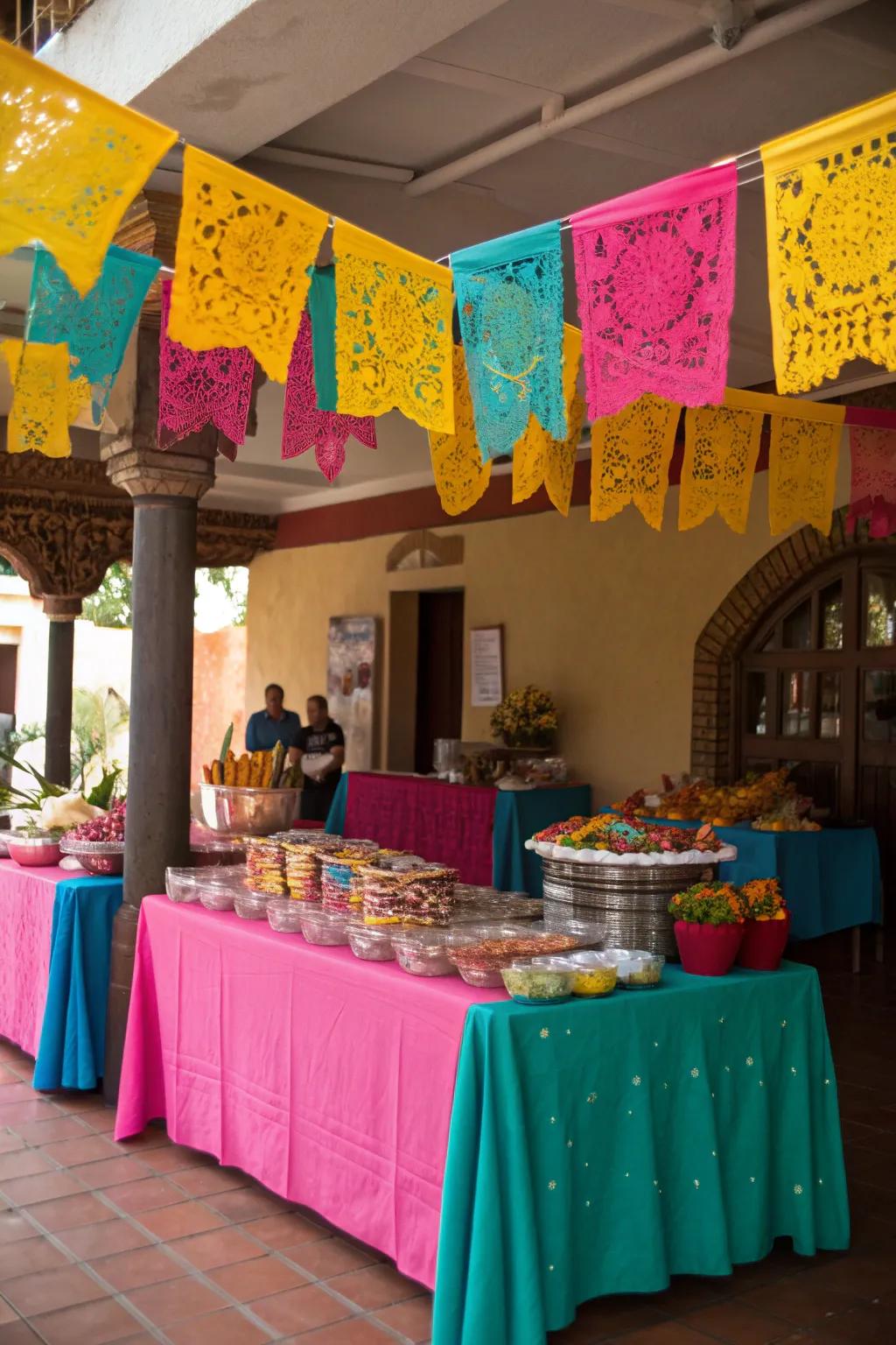 Create the perfect backdrop with vibrant tablecloths and streamers that inject a burst of color into your candy buffet.