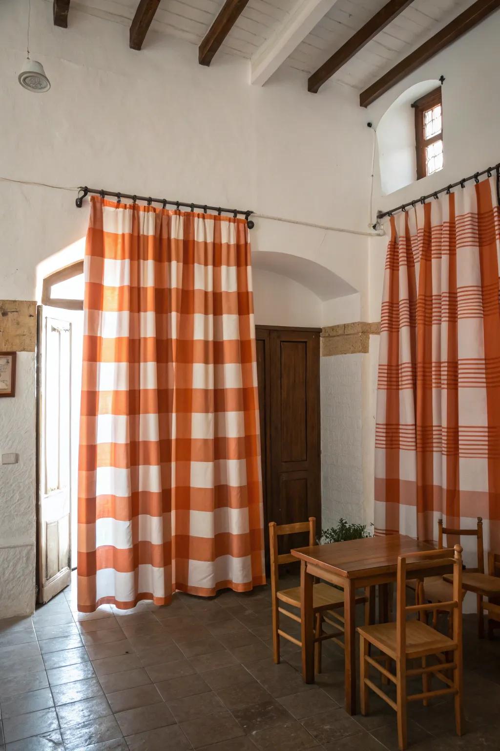 Playful tangerine and ivory striped window coverings brighten up a neutral room.
