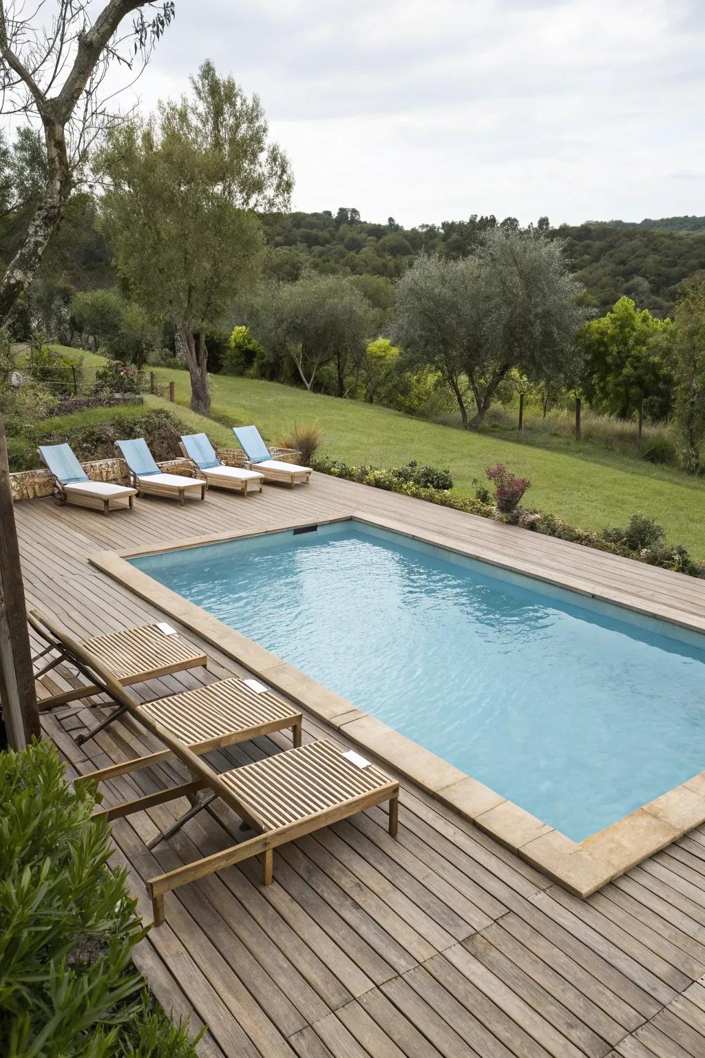 Wooden decking enhances the poolside with a warm, natural ambiance.