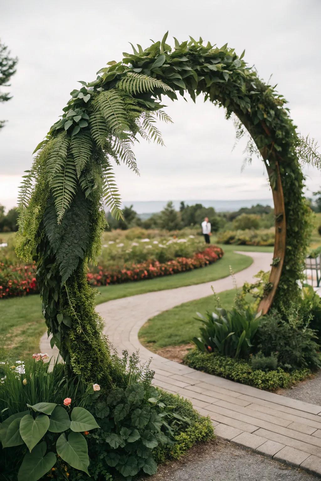 A round wedding arch filled with greenery, creating a natural feel.