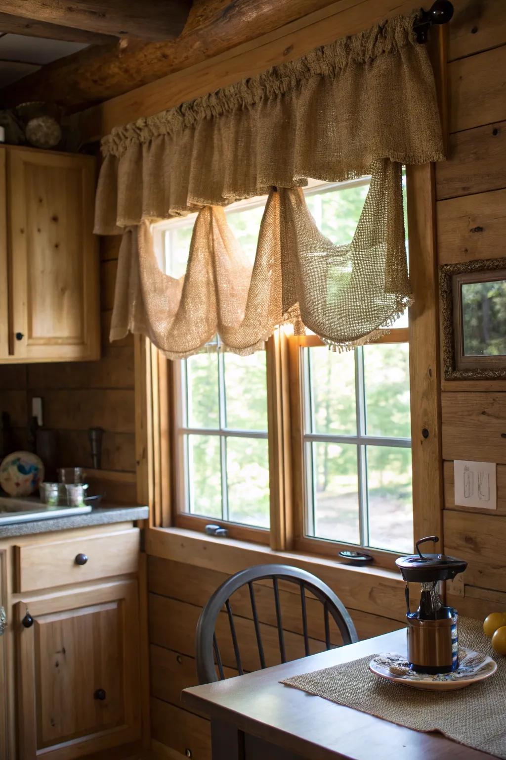 A charming kitchen featuring a hessian valance that complements the rustic wooden accents of the space.