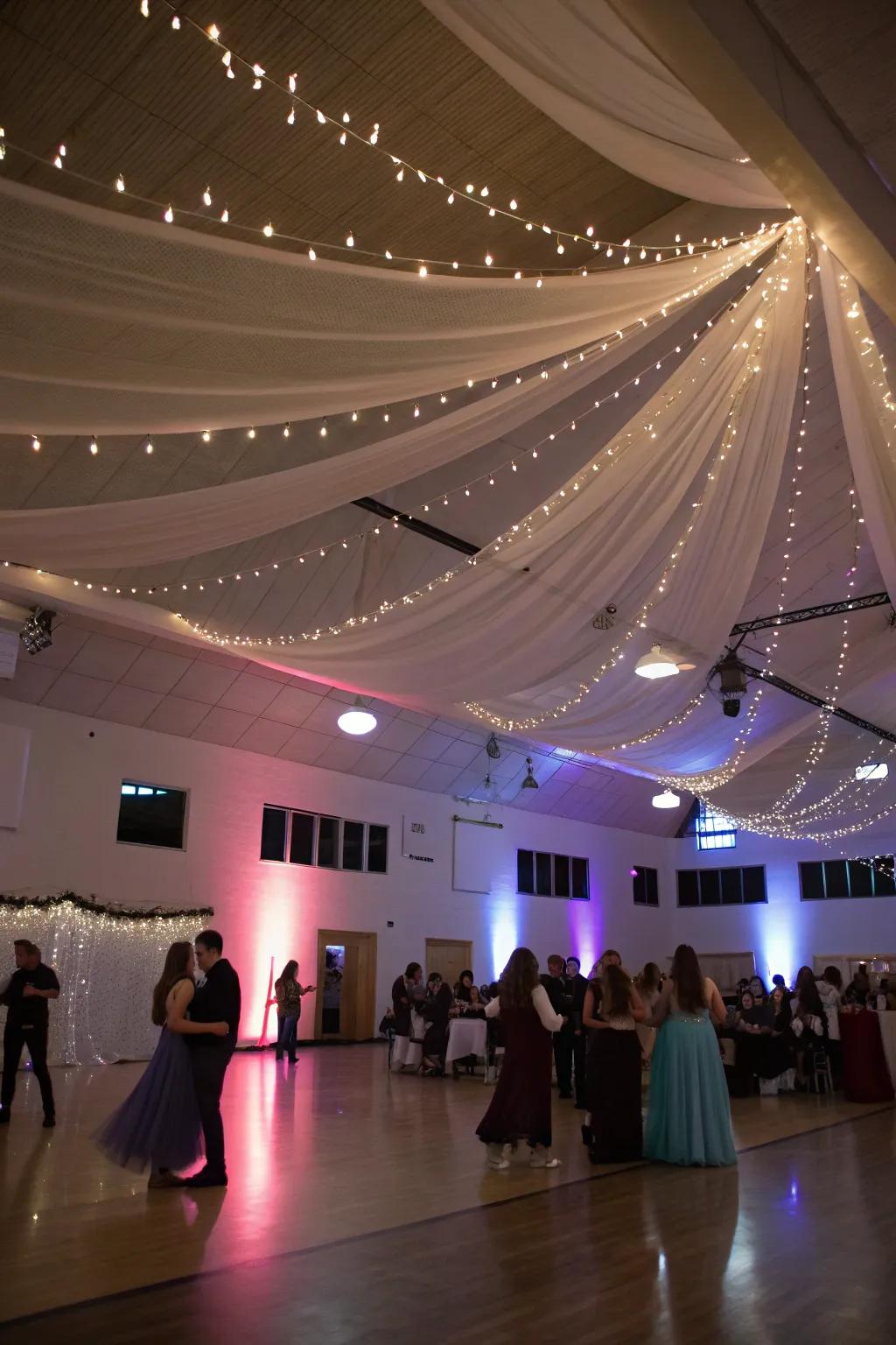 An elegantly decorated ceiling featuring flowing drapery and sparkling string lights.