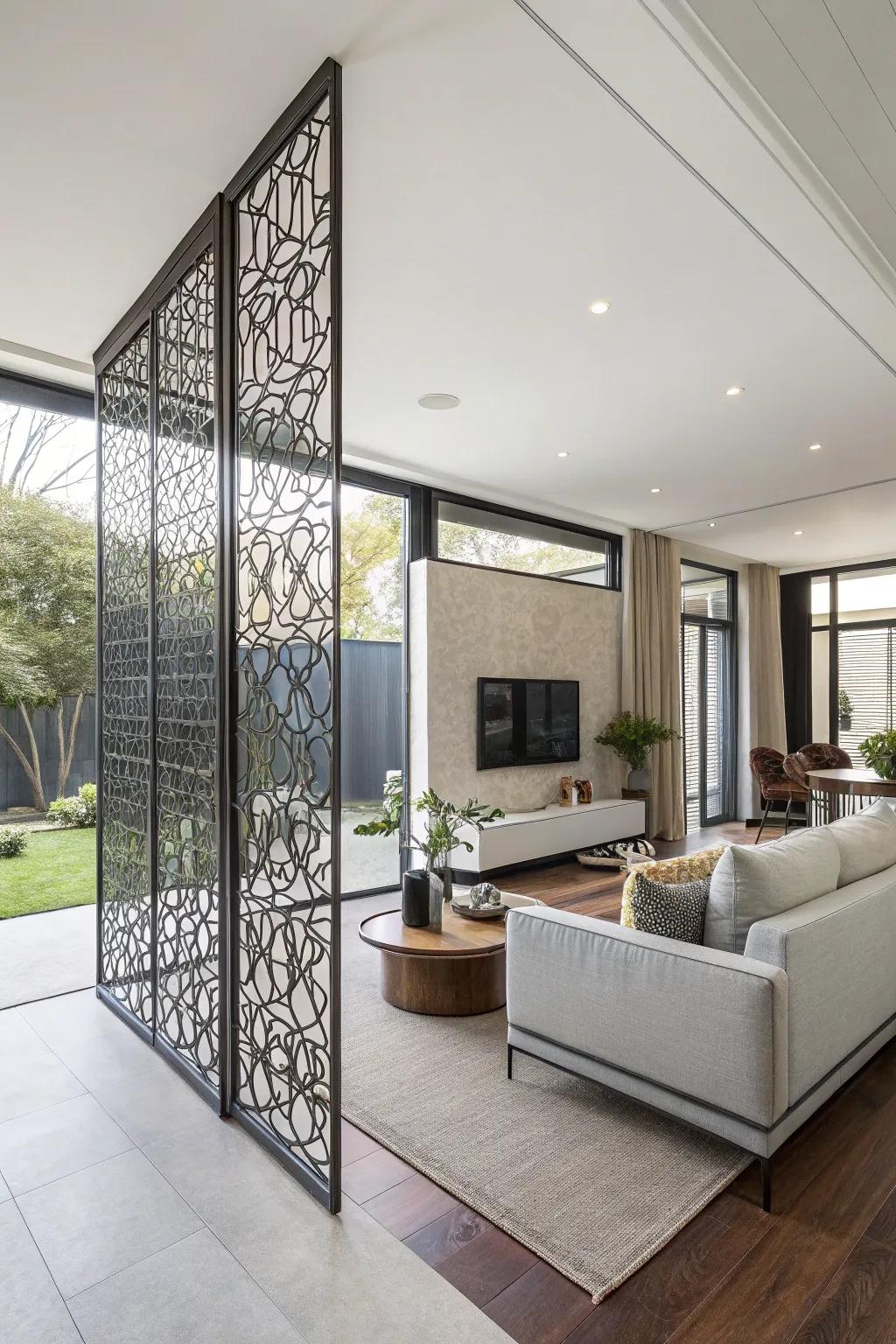 A sleek metallic screen wall defines separate zones in an open-plan lounge area.