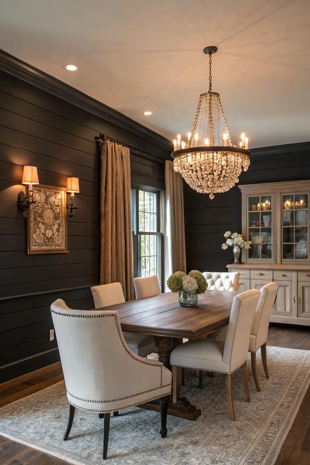 A dining room featuring dramatic dark shiplap walls and contrasting light furniture.