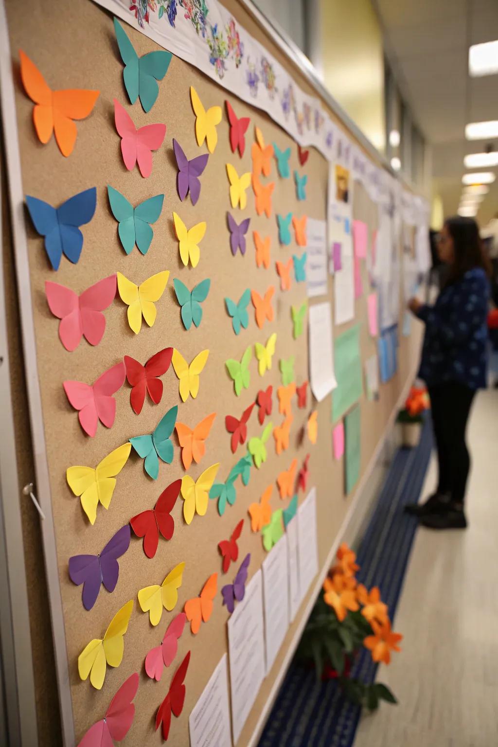 Butterflies contributing a whimsical touch to the spring bulletin board.
