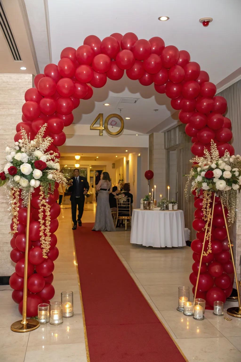 A ruby-inspired balloon archway crafts a grand entrance.