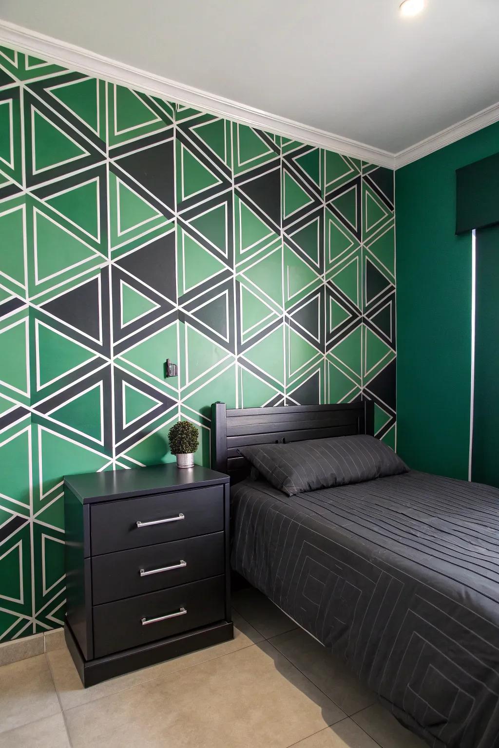 Green and black geometric wallpaper adds a modern touch.