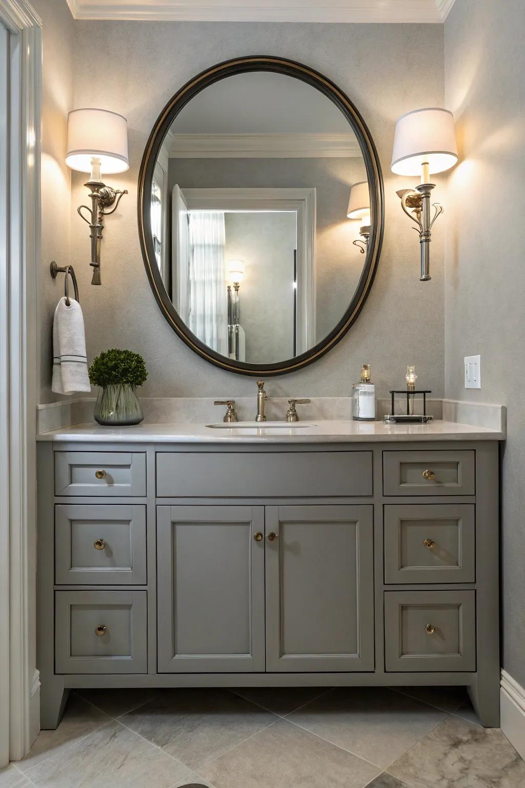 Classy lighting and a circular mirror elevate the visual appeal of the grey vanity.