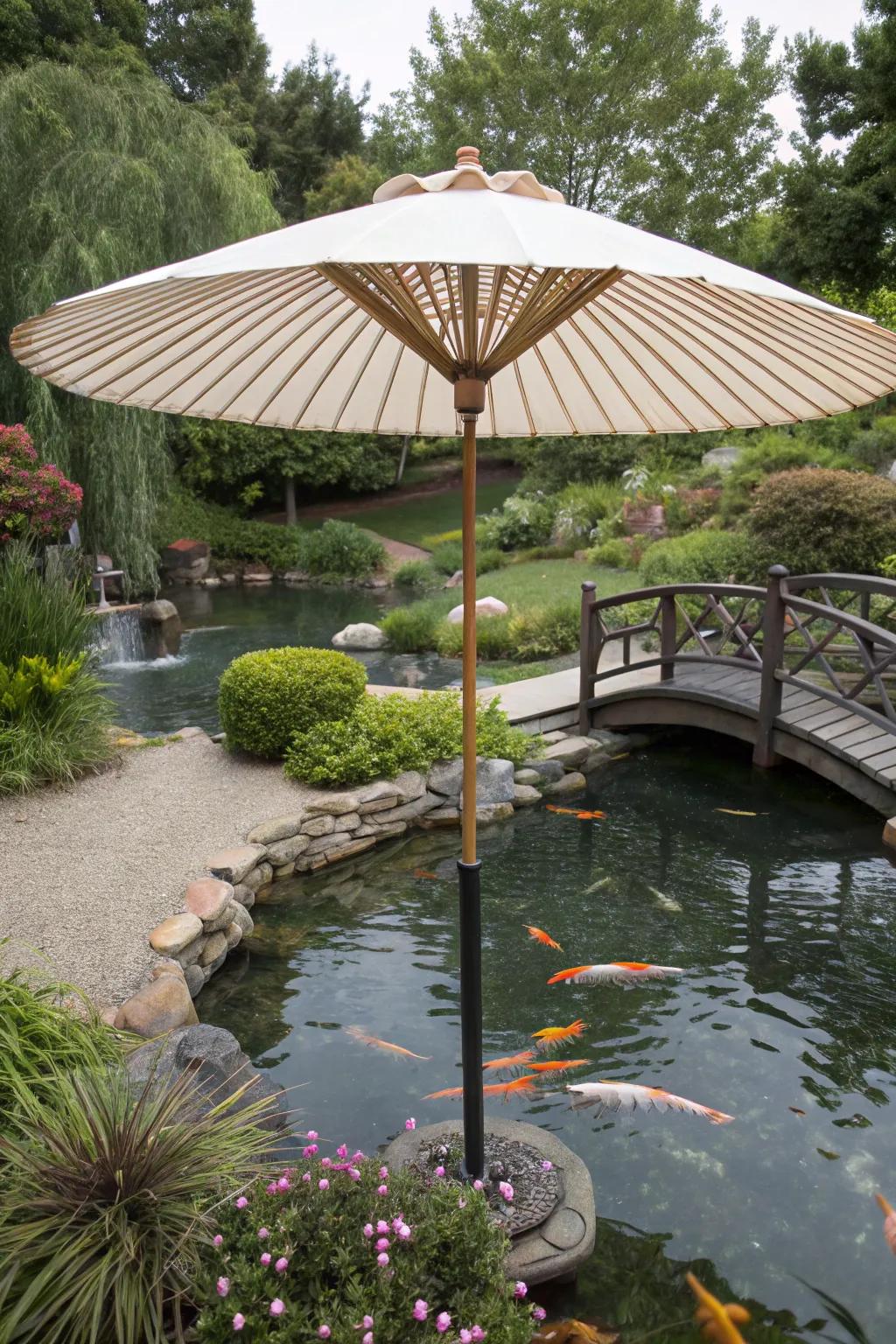 A koi pond sheltered by a generously sized garden umbrella.