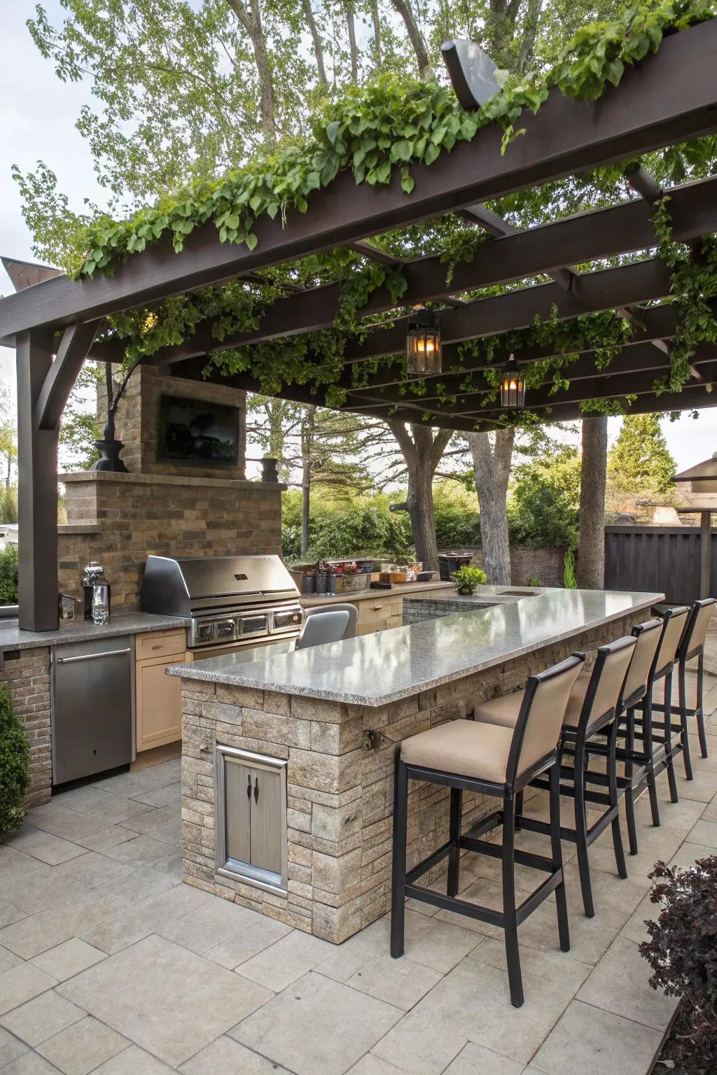 An inviting outdoor cooking island with bar stools and a seating area under a pergola.
