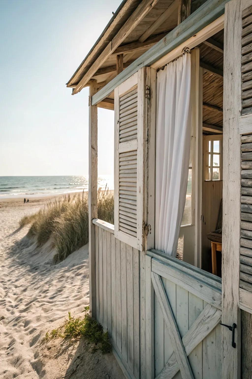 Open shutters allow a coastal breeze into the beach shed.