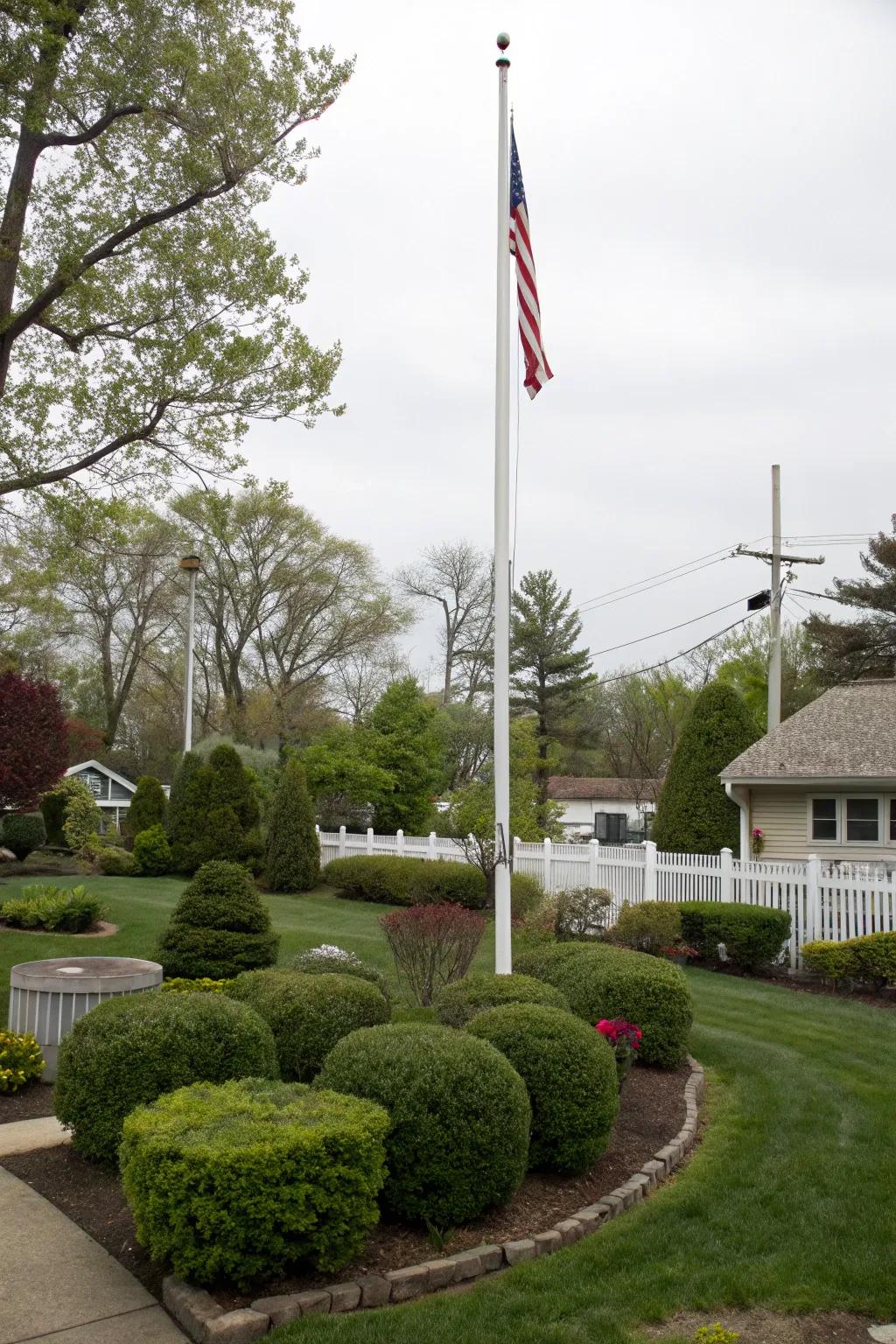 Bushes and small trees offer a vibrant backdrop for every flagpole.