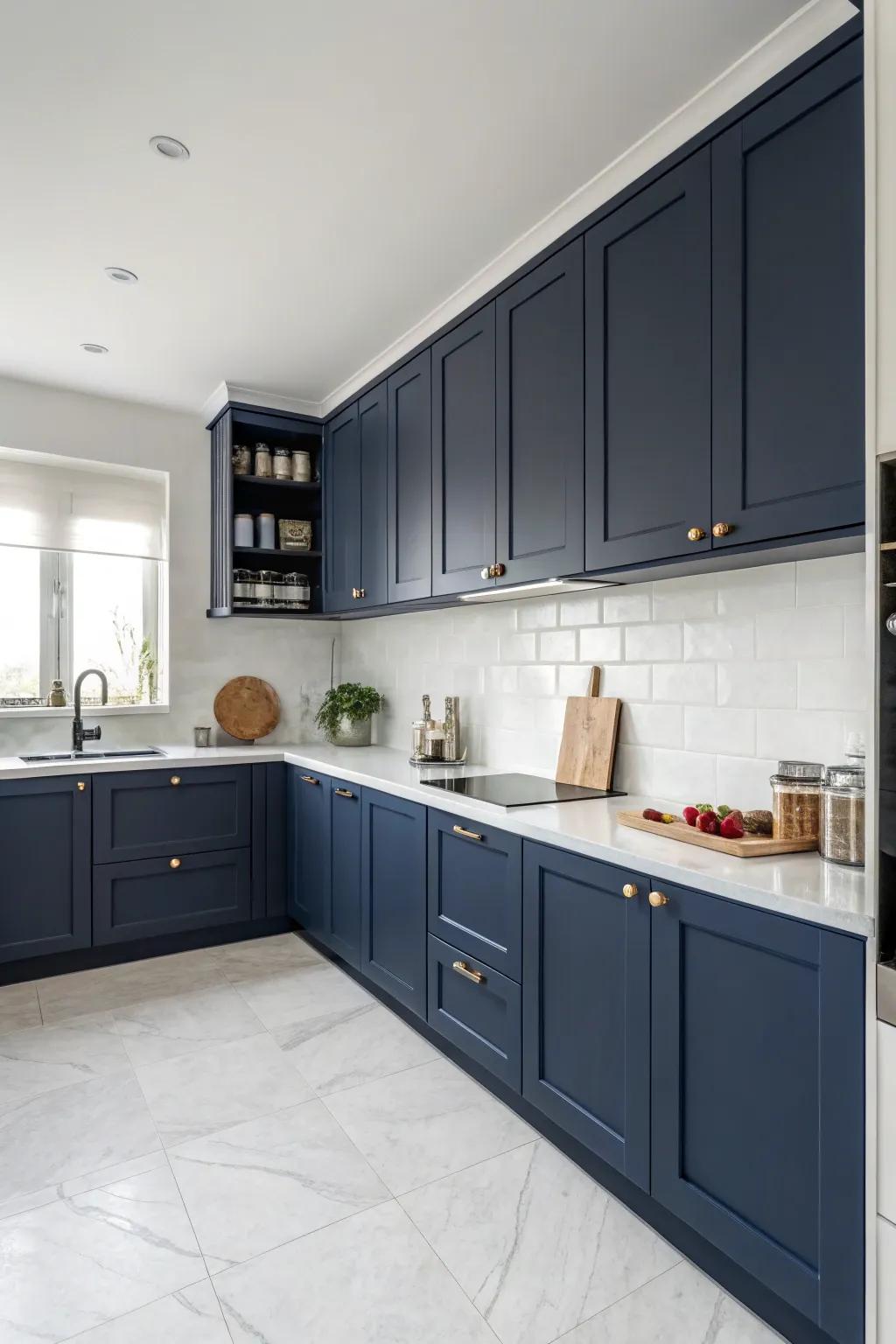 Understated deep sea-inspired cabinets offer a streamlined and contemporary kitchen appearance.