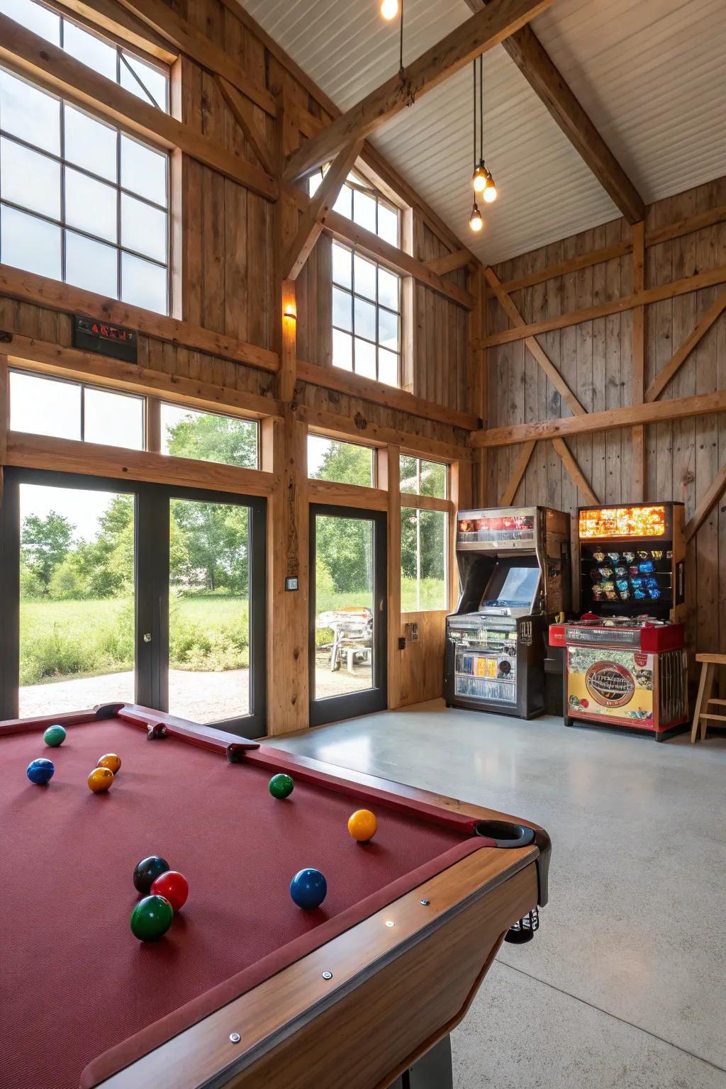 A recreation room within a pole barn equipped with a billiards table and classic arcade machines.