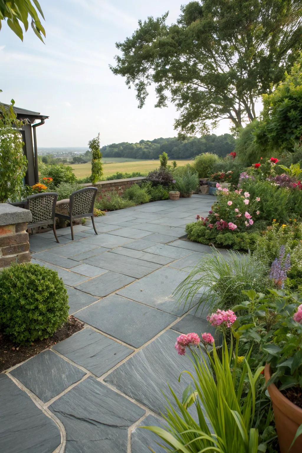 A slate patio exquisitely merged with flourishing vegetation.