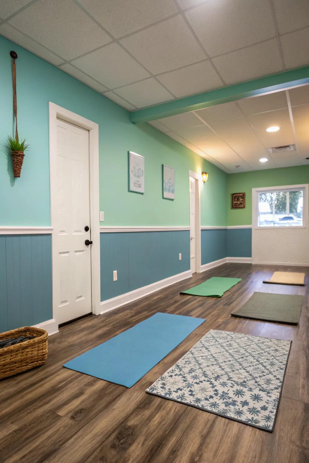 Small yoga room featuring walls painted in calming blue and green tones.