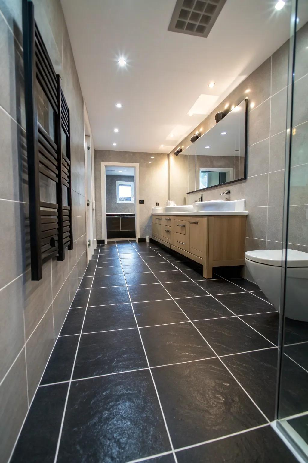 Large black surfaces create a smooth and expansive look in this bathroom.