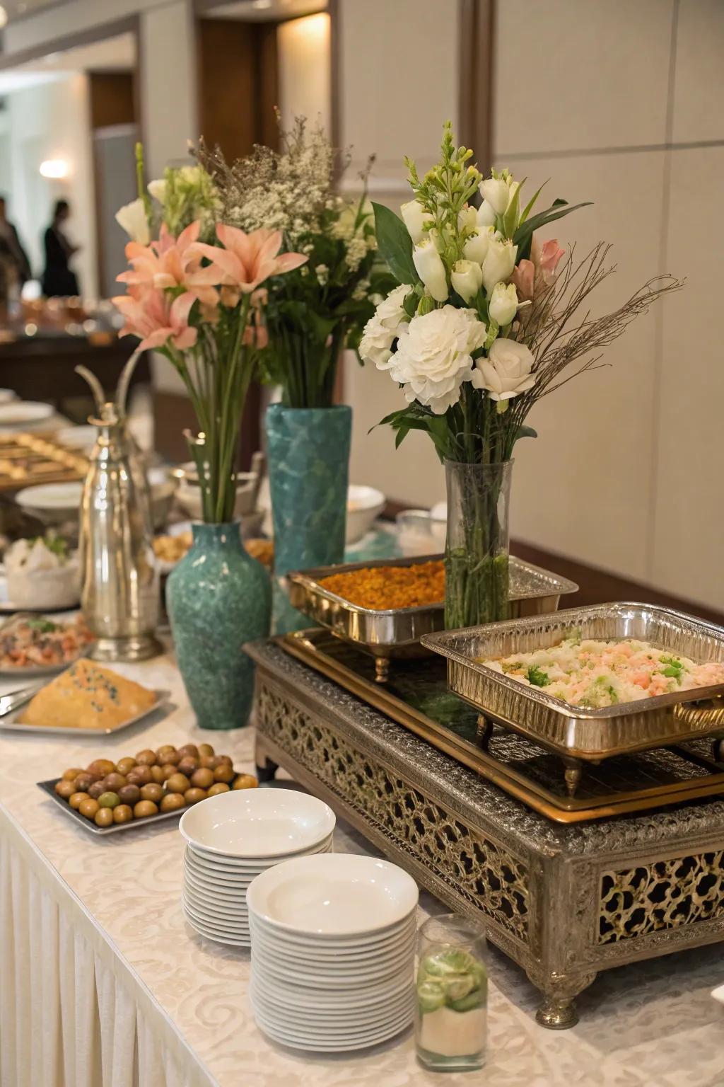 Serving boards and tall vases create an elegant and well-organized buffet display.