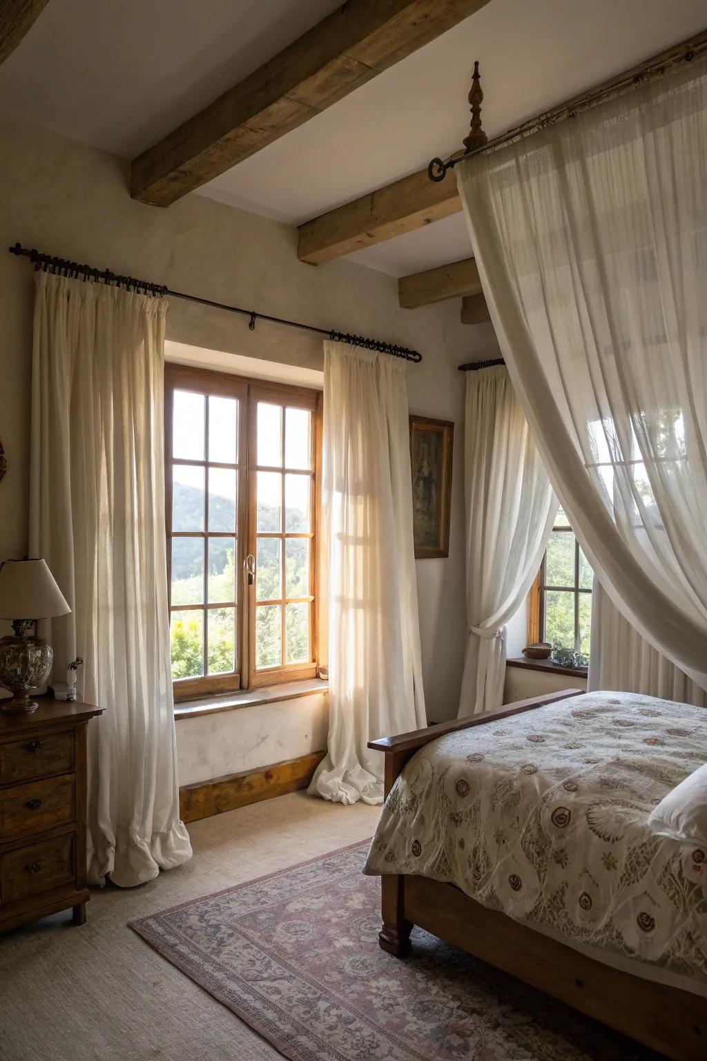 Layered semi-sheer and thick window coverings creating dimension in a farmhouse bedroom.