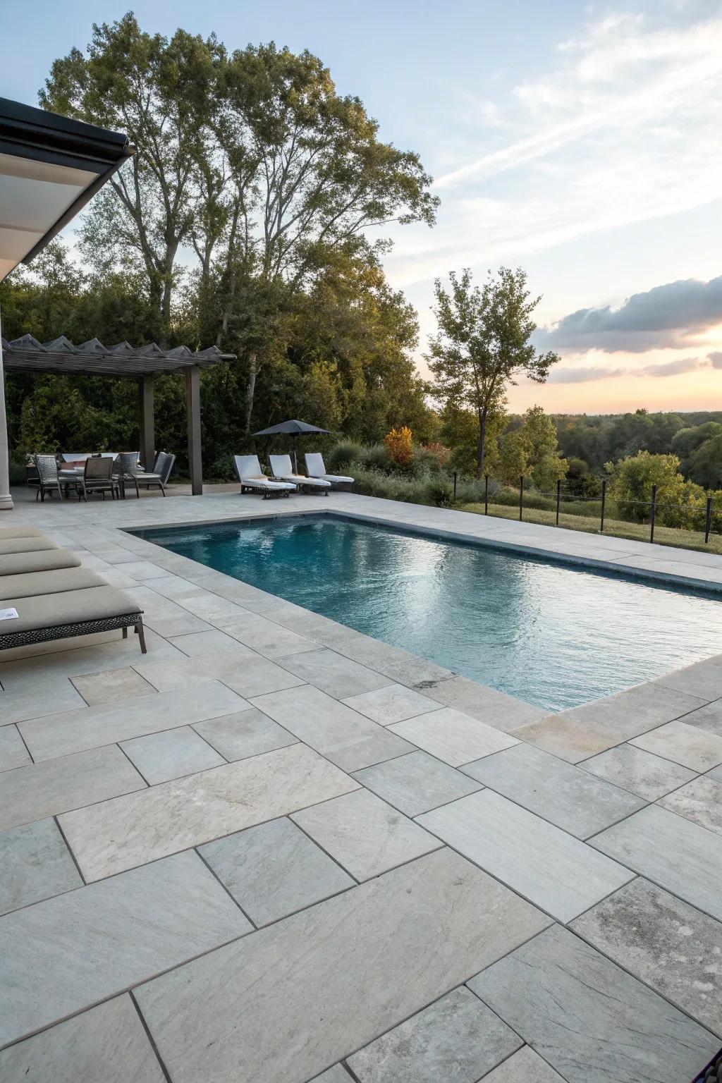 Savor toughness and style with a stone surface pool deck.