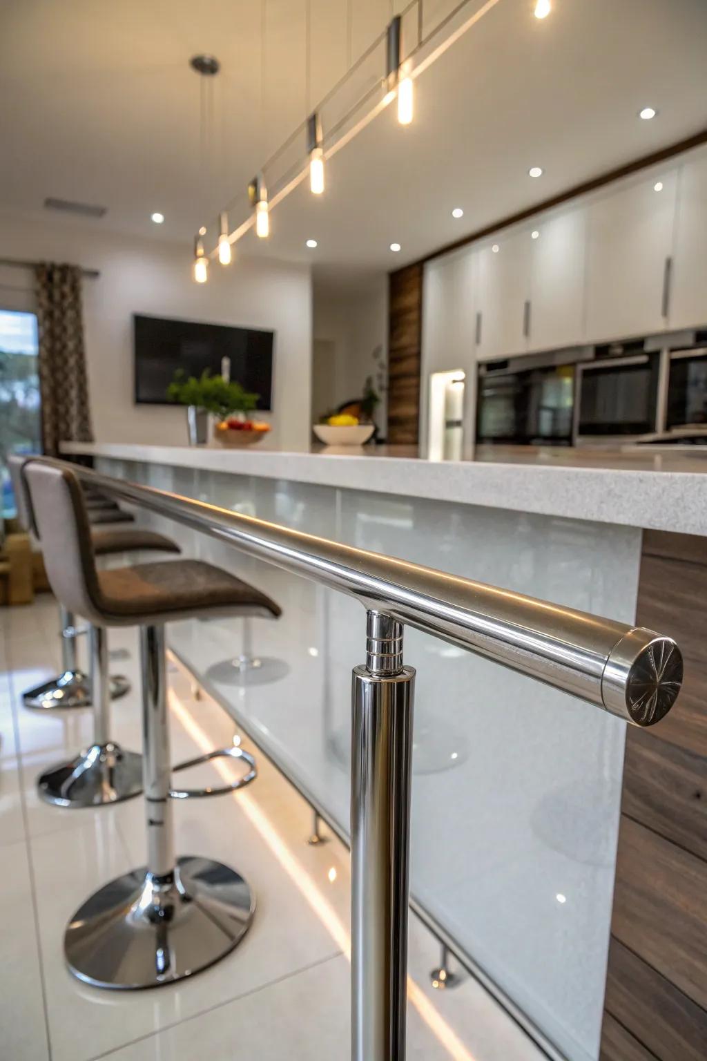 A polished metal foot rail for a modern and chic look.