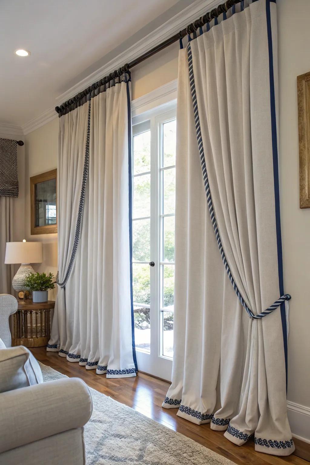 Sharp looking curtains featuring contrasting cord trims.