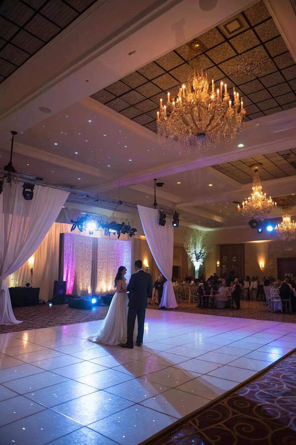 Spotlights and uplighting draw attention to the dance floor.