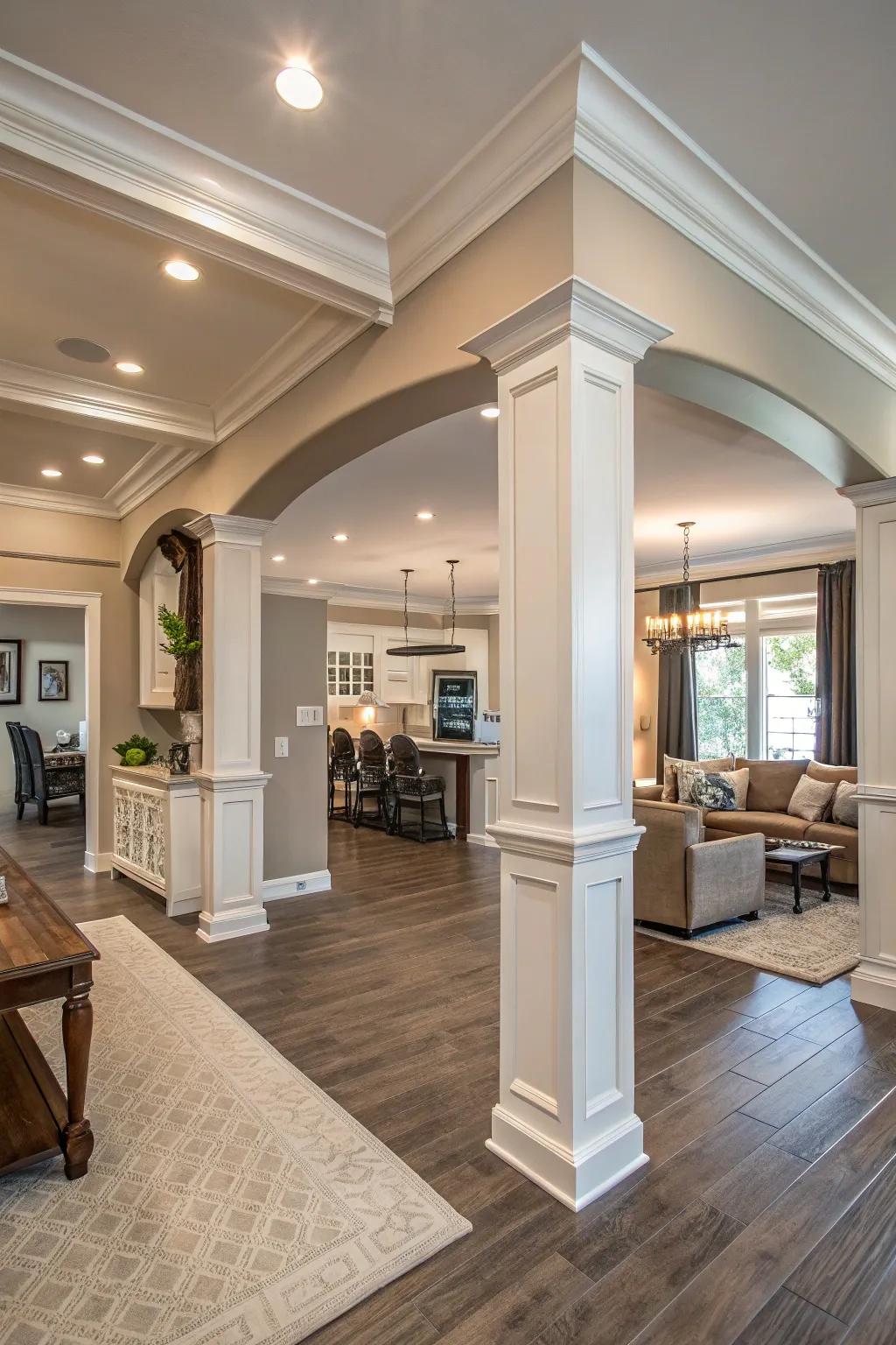 An open-layout living area with wide crown molding, lending an impression of splendor and unity.