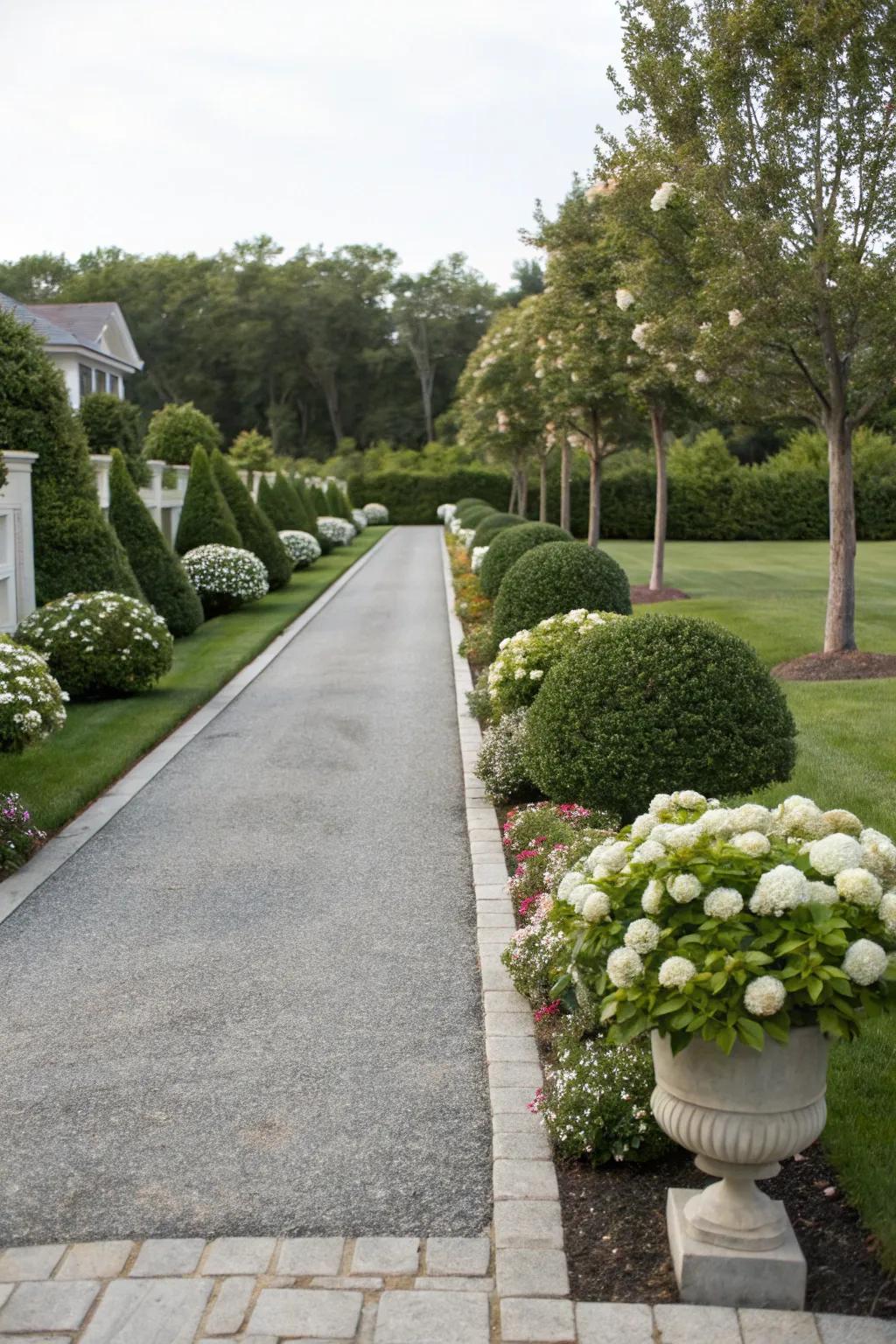 Symmetrical landscaping brings a sense of harmony to the driveway.