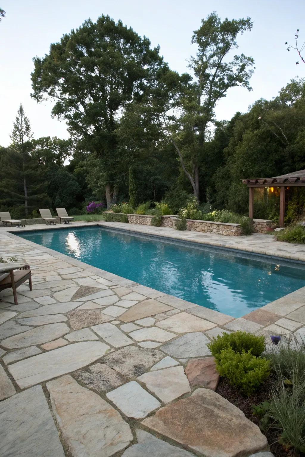 Natural stone decking brings classic elegance and durability.