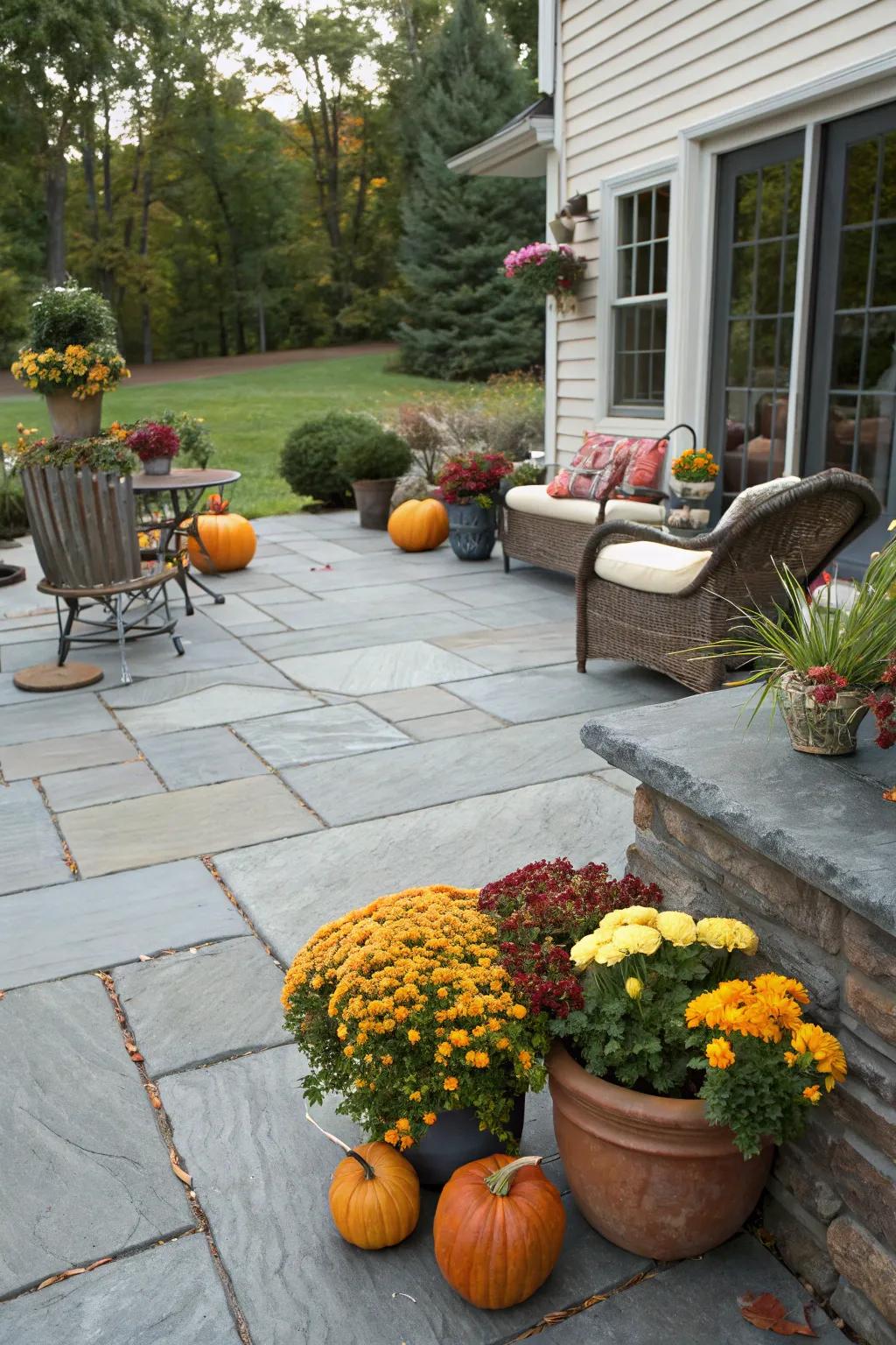 A slate patio embellished with delightful seasonal decor.