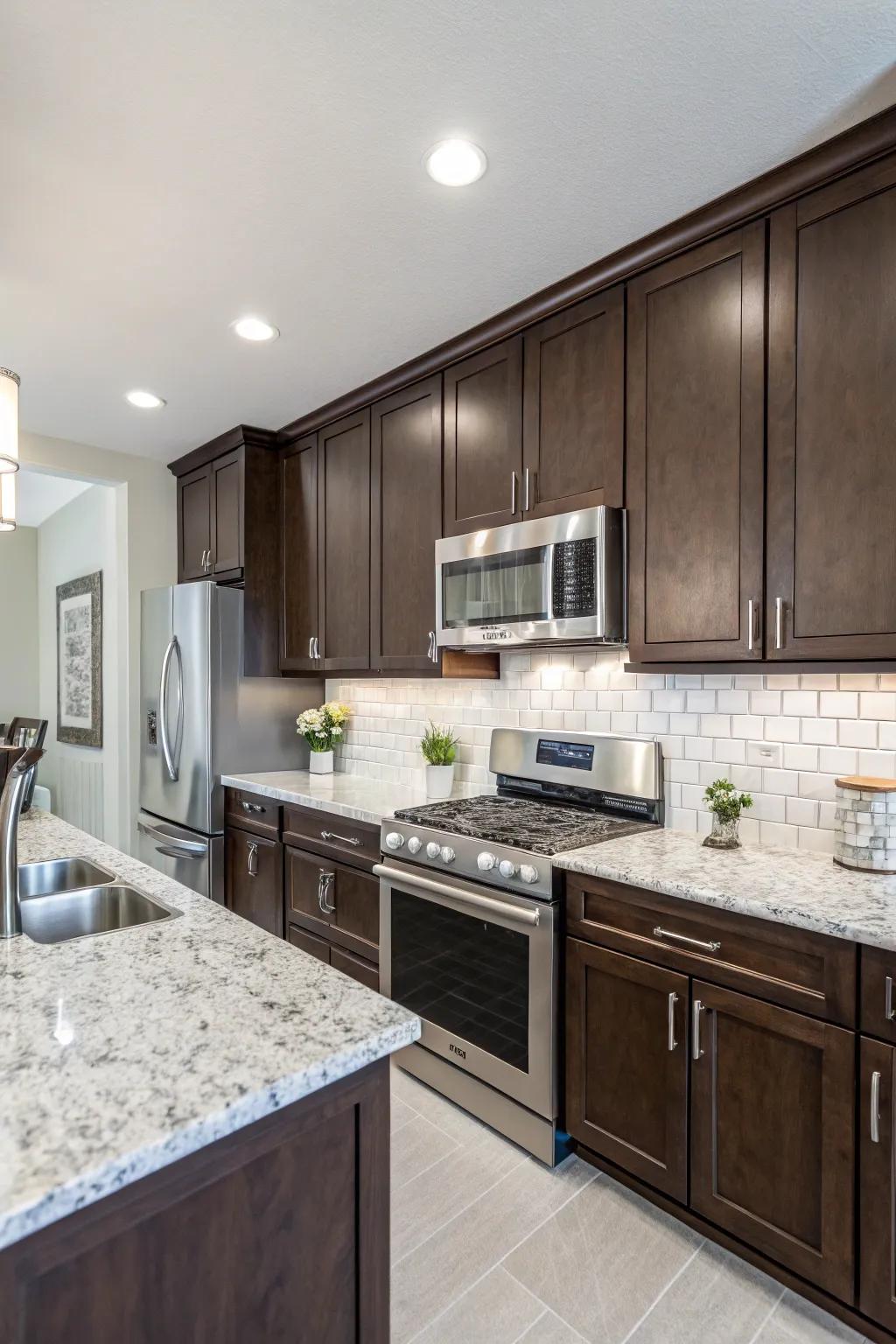 Dark cabinetry brings out the delicate elegance of frost white granite.