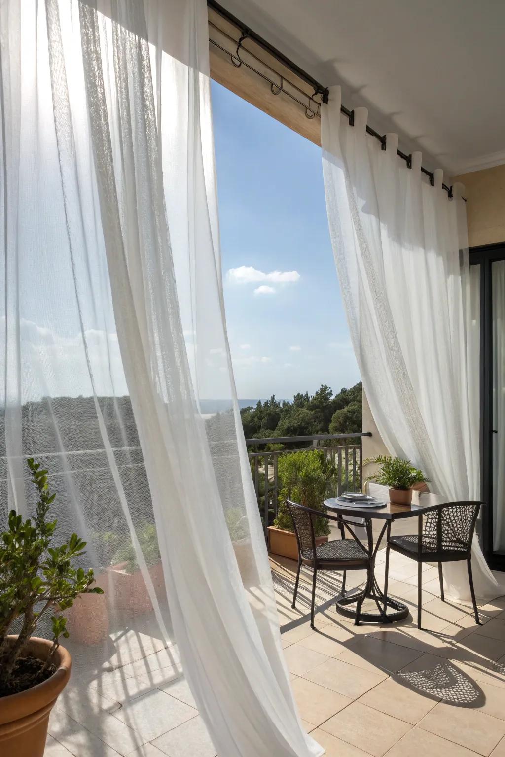 Sheer curtains creating a soft, shaded atmosphere on a balcony.