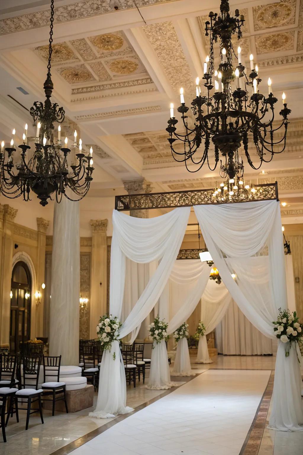 Dark-colored chandeliers add an elegant detail to a stylish wedding venue.