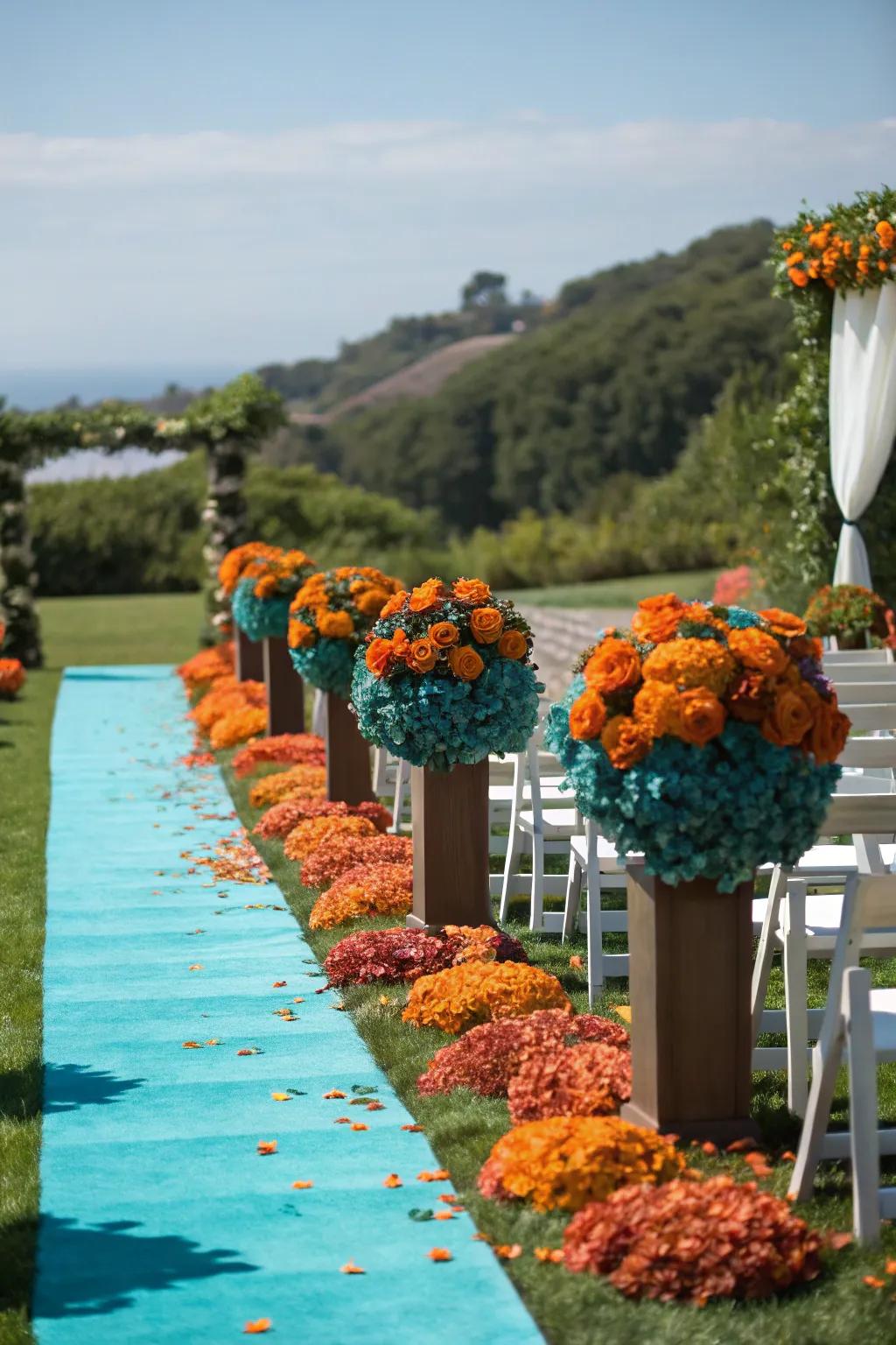 A wedding aisle adorned with aquatic blue and sunset flowers.