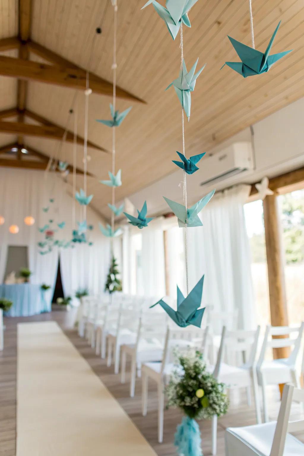 Add a whimsical touch to your wedding through exquisite sculpted paper bird adornments.