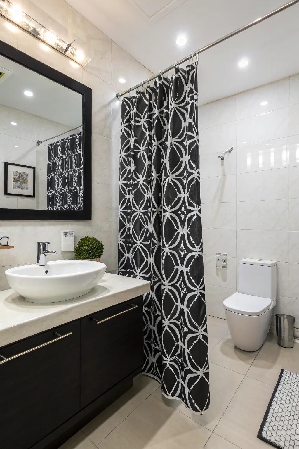 An eye-catching black and white shower curtain enhances this modern bathroom.