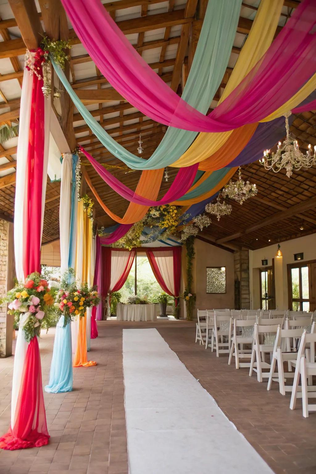 A wedding venue embellished with vibrant rainbow drapery.