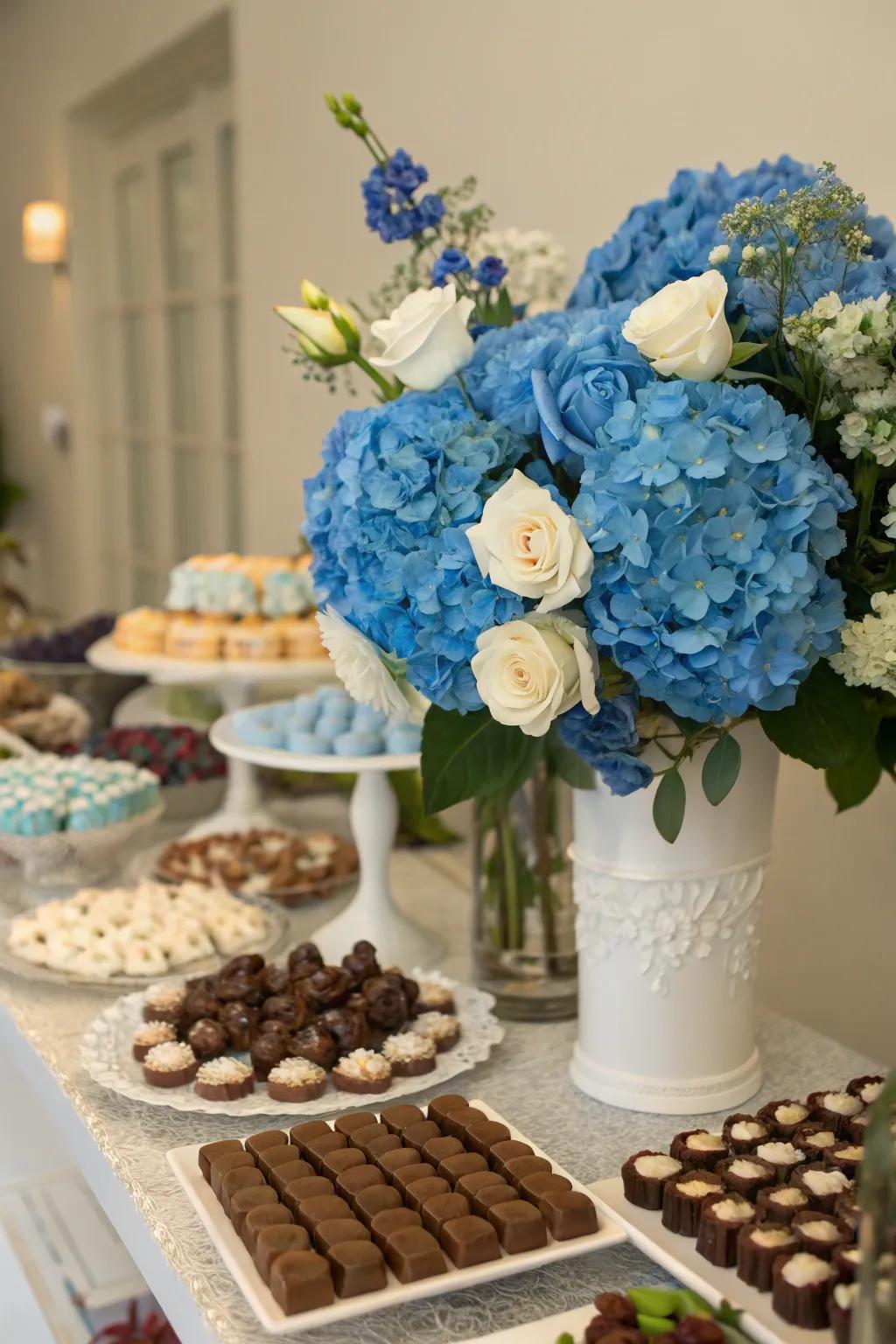 Blue floral decorations incorporating a fresh, natural touch to the dessert arrangement.