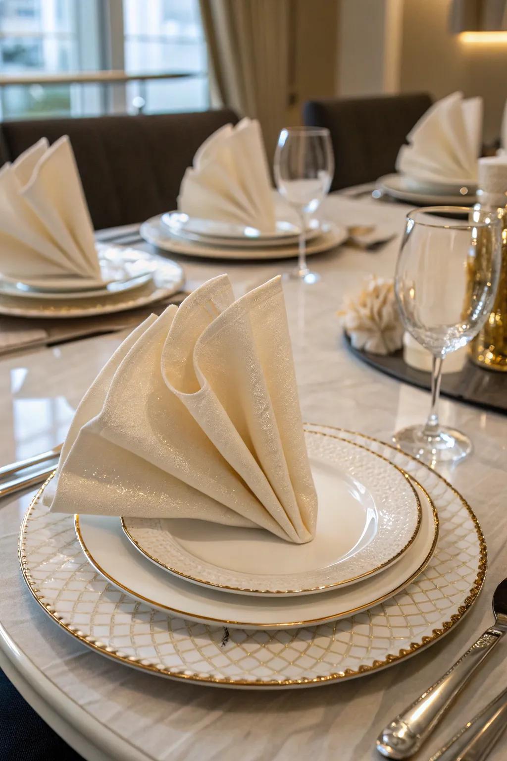 Elegant napkin folds provide a sophisticated accent.
