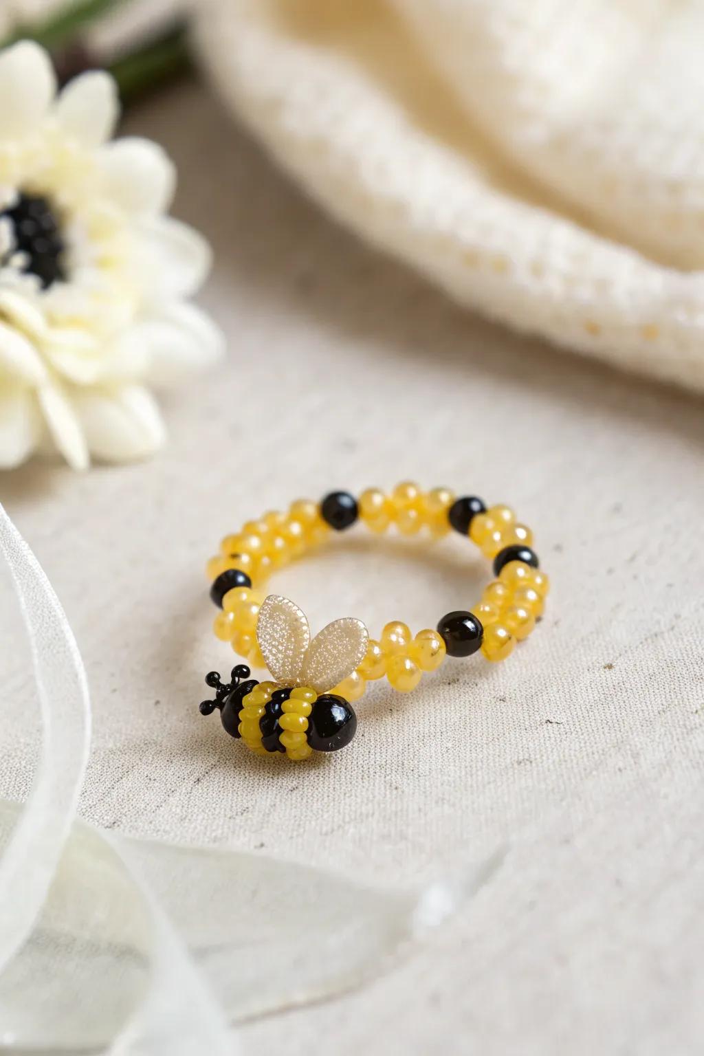 Create a buzz with this enchanting winged insect beaded ring, a flawless blend of simplicity and elegance.