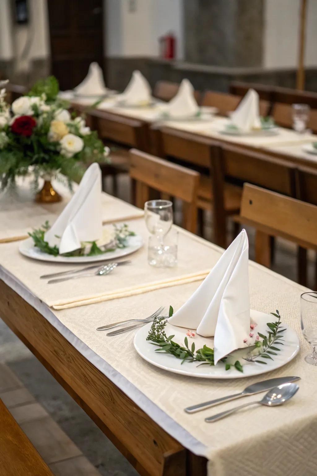 Elegant napkin folding contributes a refined detail to dining experiences.