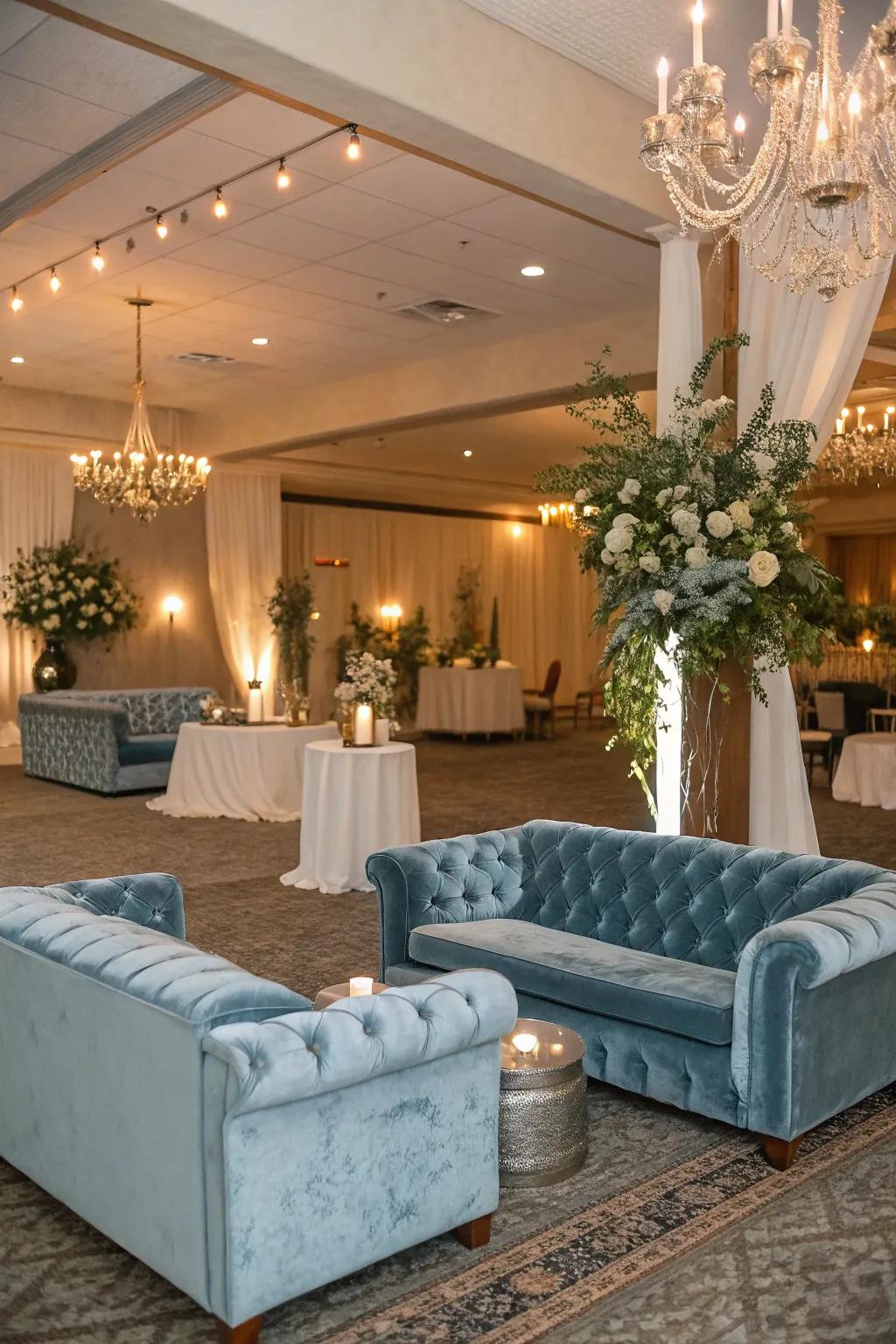 A plush lounge area featuring dusty blue velvet seating, inviting guests to relax and enjoy the celebration.