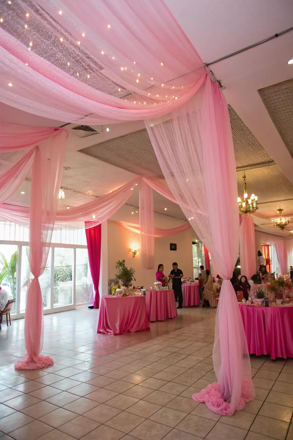 Pink tulle drape creates an ethereal and fanciful party ambiance.